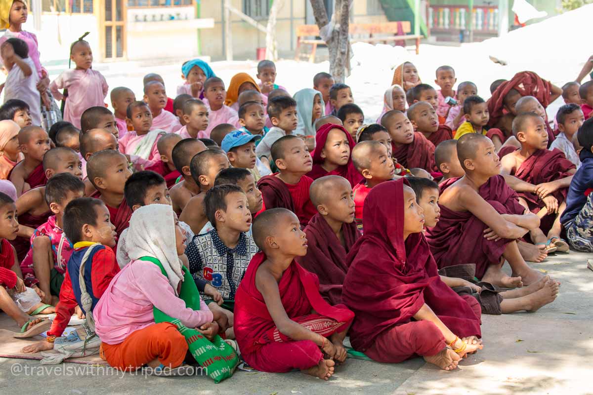 Young children sit engrossed watching cartoons at the Aung Myae Oo Monastic Free Education School in Sagaing, Myanmar