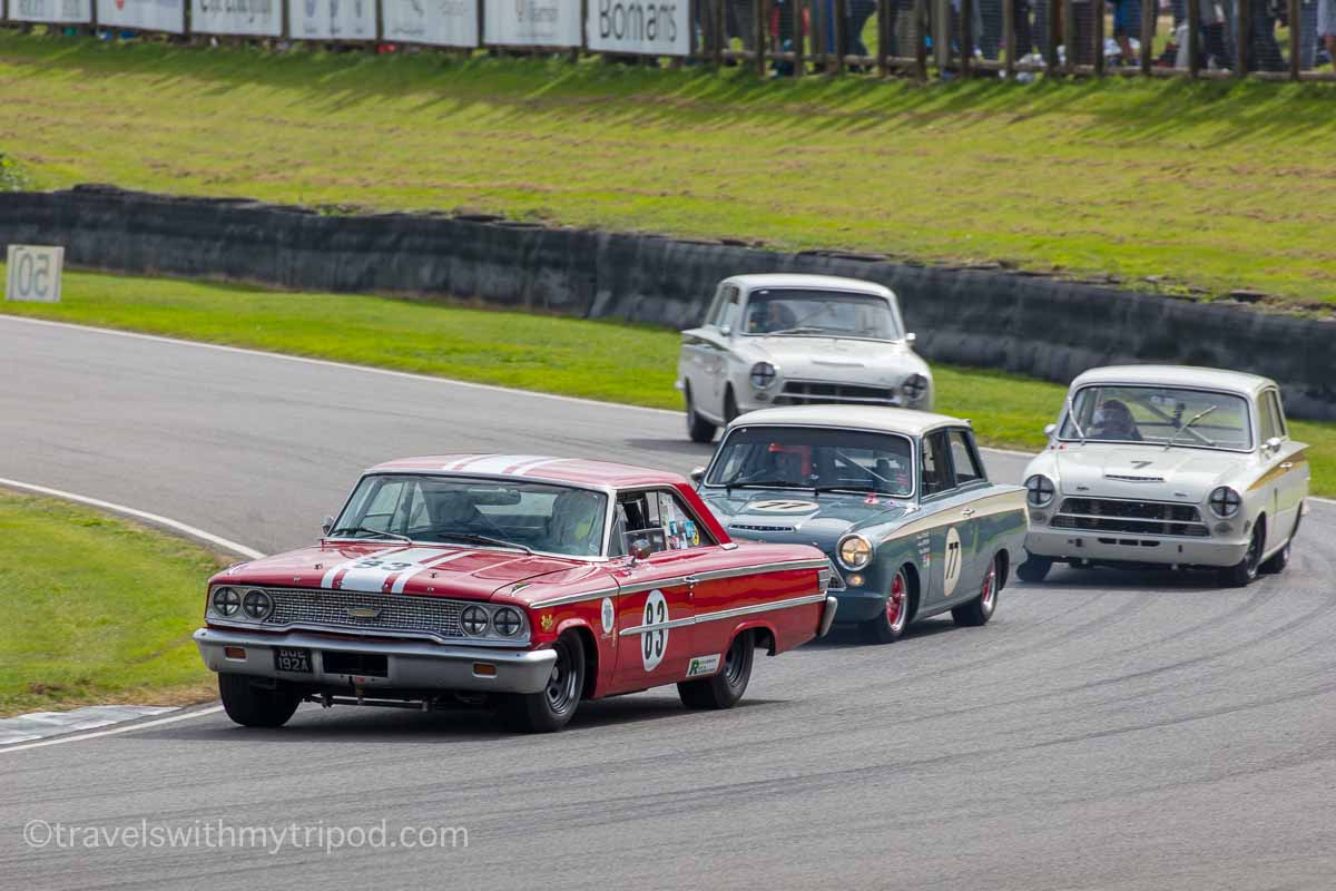 Ford Galaxy and Lotus Cortinas race in the St Mary's Trophy at Goodwood Revival