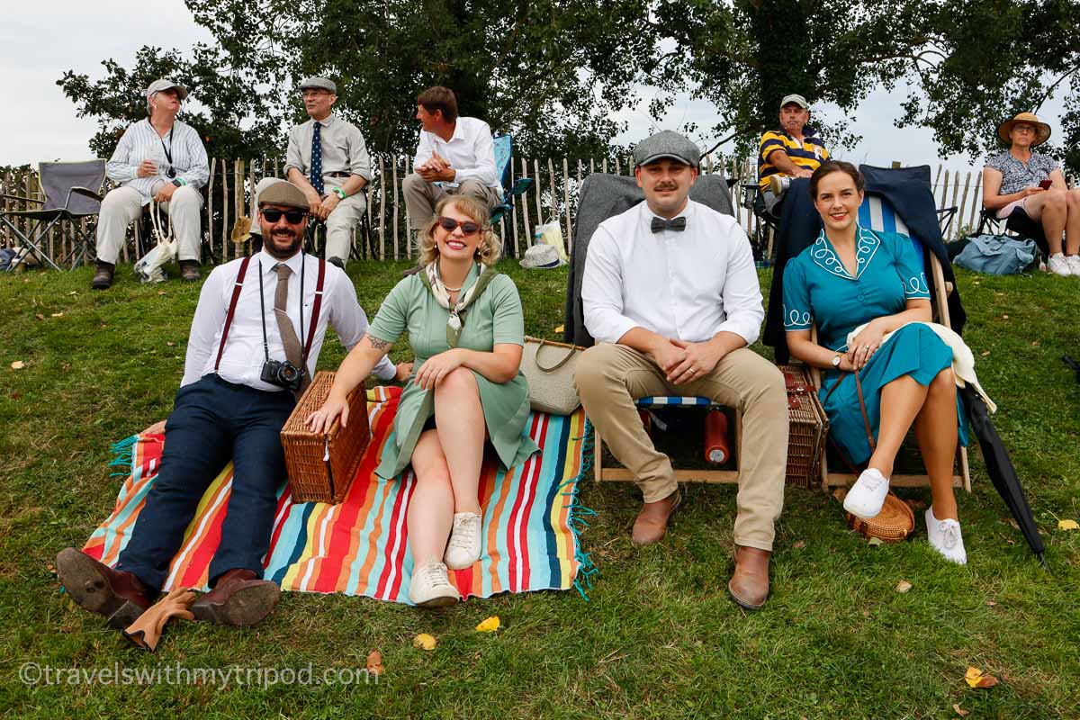 Group dressed in vintage outfits at Goodwood Revival