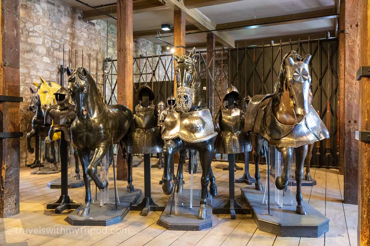 Life-size wooden horses in armour