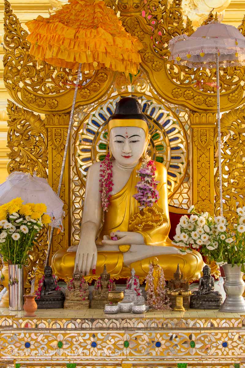 A colourful statue of Buddha at Kuthodaw Pagoda