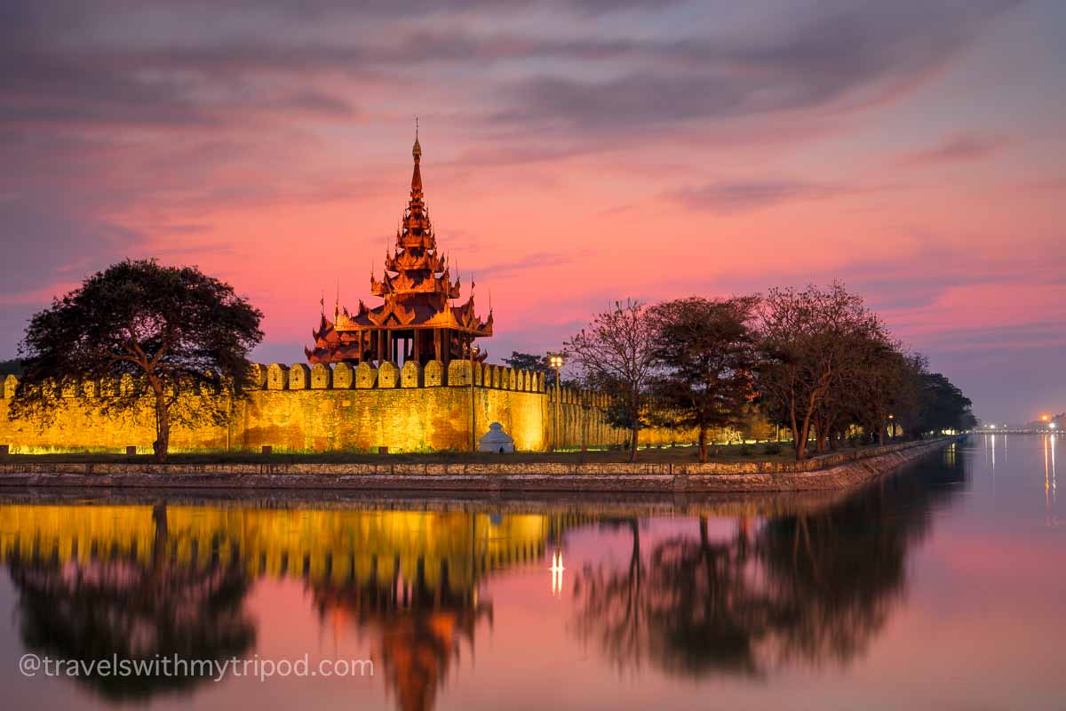 Sunset at the north east corner of the City moat and City wall in Mandalay